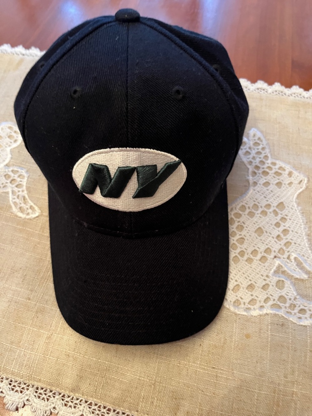 NFL Black Hat with White Oval and Green NY Logo